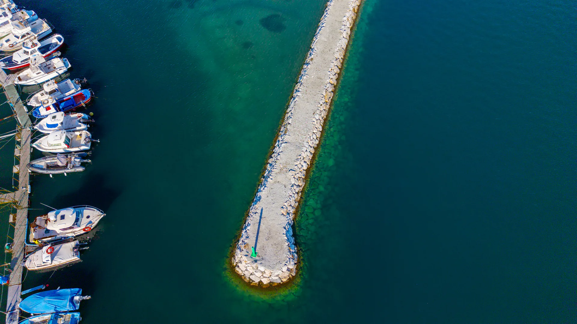 Harbor waters and port infrastructure defining the operating area for underwater security