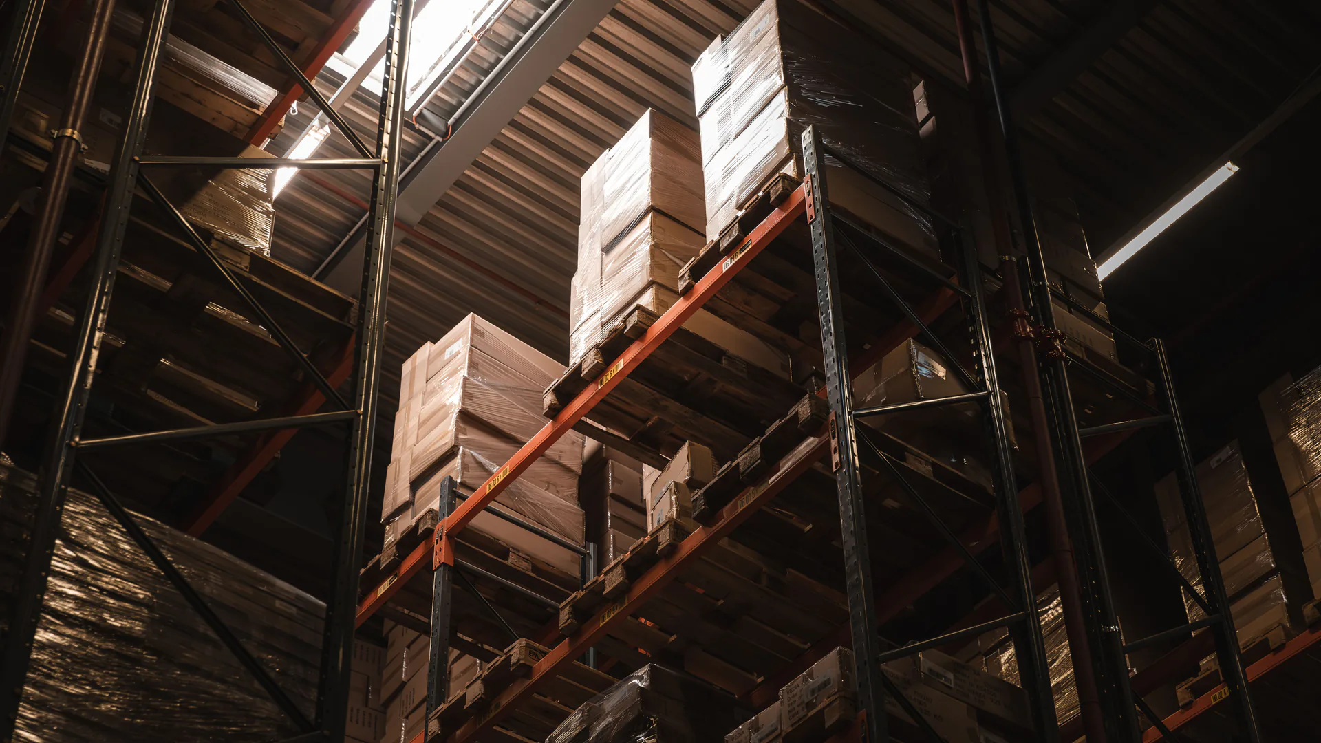 Freight pallets in a logistics warehouse awaiting import classification and tariff review