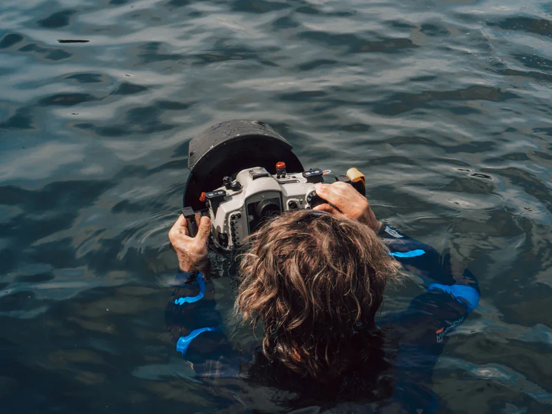 Underwater inspection operation showing the launch, tether, sensing, and recovery parts of an unmanned mission
