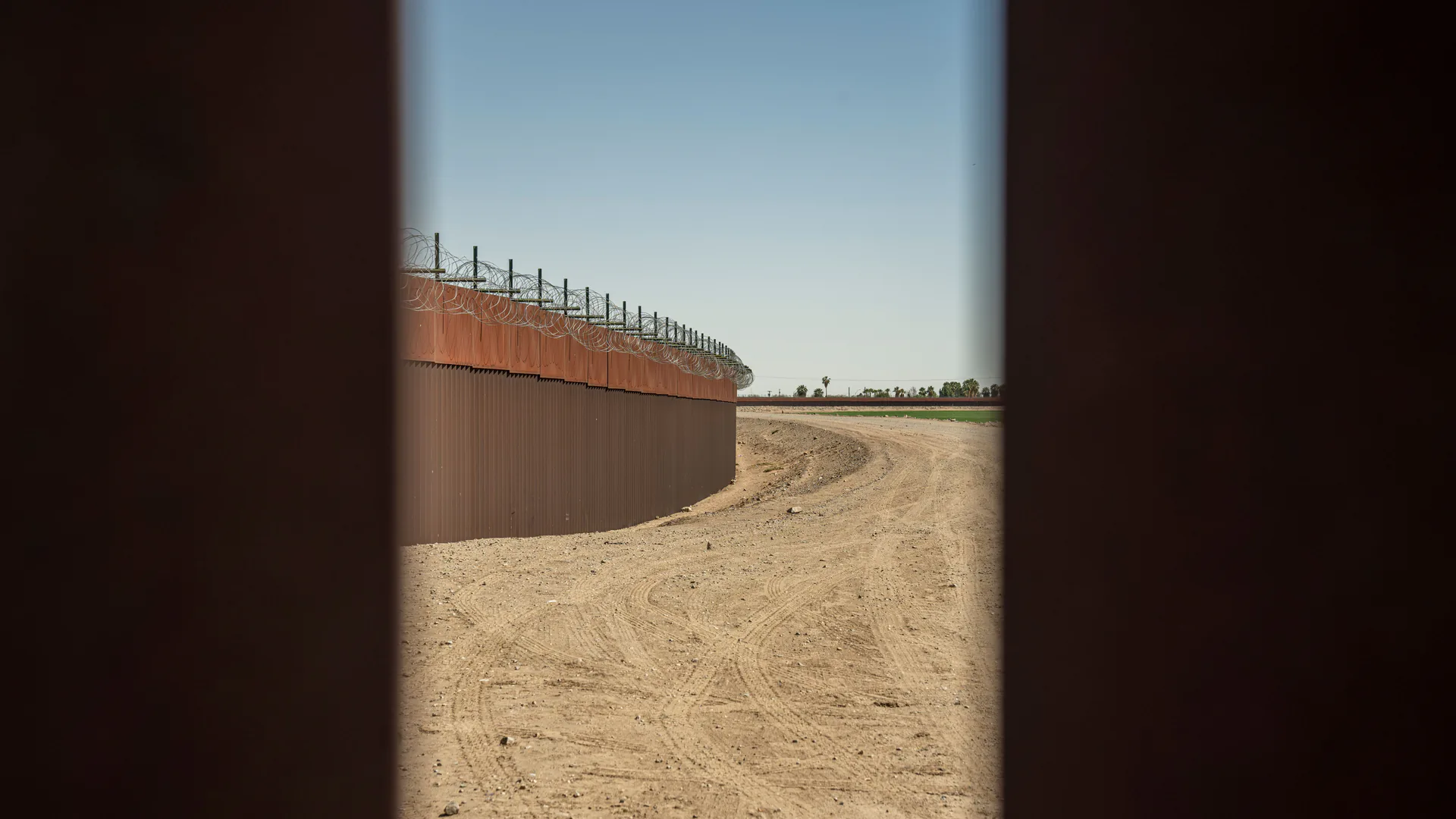 Remote border barrier and patrol route illustrating a defined surveillance sector