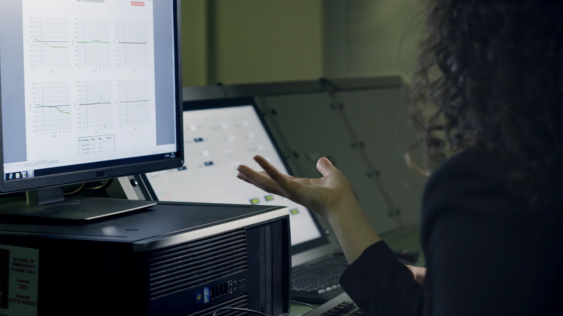 Engineer reviewing radio measurements during an RF drone detector field evaluation