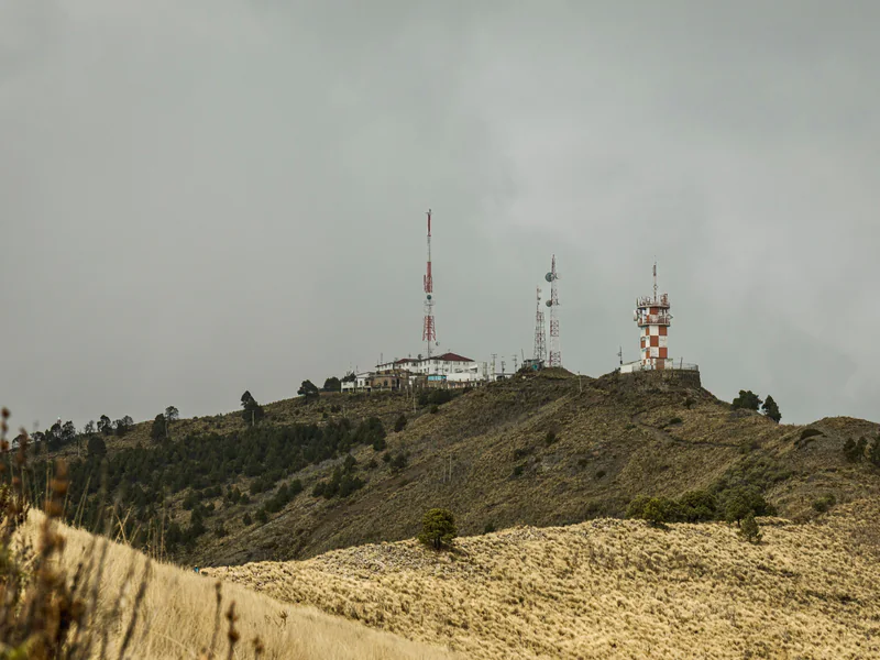 Ridge-top monitoring infrastructure illustrating exposed siting, communications and environmental measurement constraints
