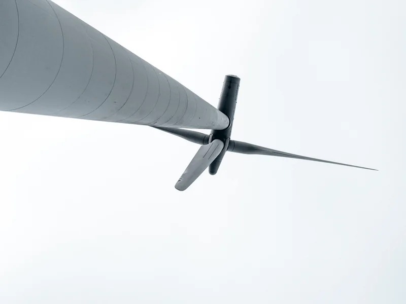 Wind-turbine blades viewed at close range where inspection imagery must preserve sharpness, angle and defect location